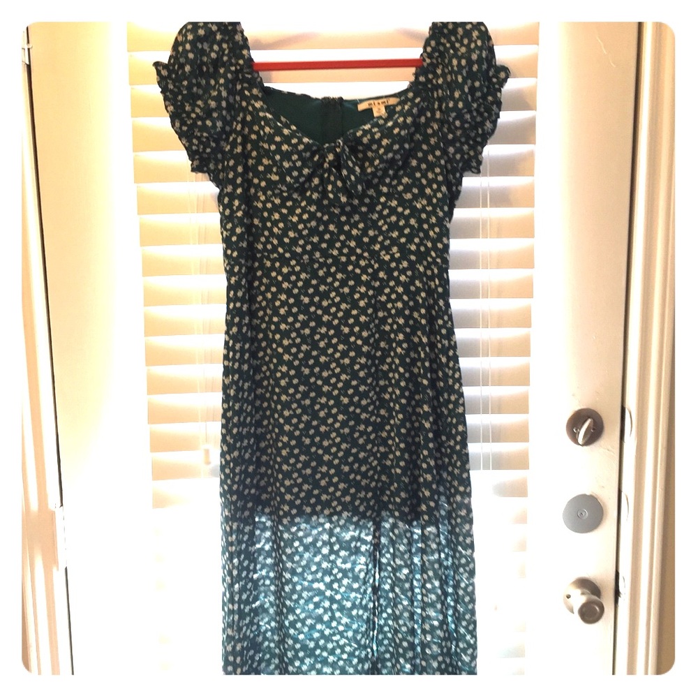 Flowy dark Green dress with white flowers.